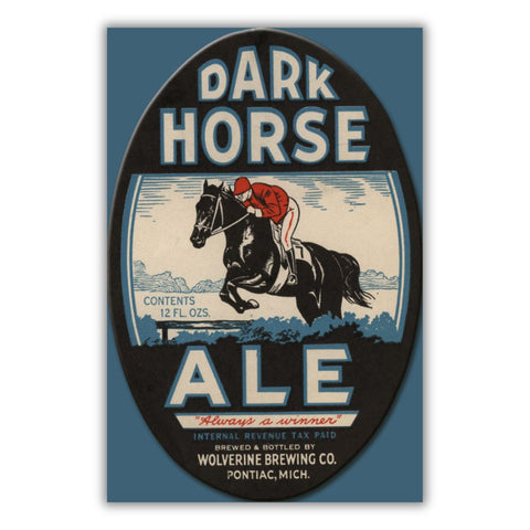 Beer label for Dark Horse Ale featuring a man riding a black horse with text in blue, white, and red on a black background. Text reads “Dark Horse Ale “Always a winner” Internal Revenue Tax Paid Brewed & Bottled by Wolverine Brewing Co. Pontiac, Mich.”