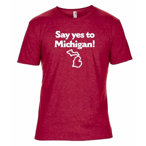 Front of a red t-shirt featuring the text in white lettering “Say yes to Michigan!” with a white outline of the state of Michigan beneath it.
