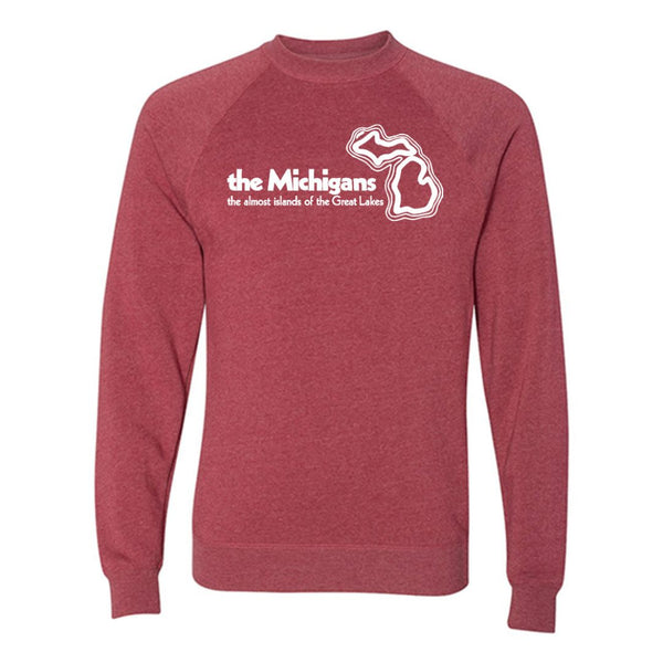 A heathered red crewneck sweatshirt with a white logo on the chest that reads “The Michigans the almost islands of the Great Lakes” with an outline of the state of Michigan.