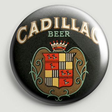 The front of a round bottle opener magnet featuring the logo for Cadillac Beer.