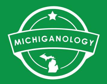 White outline of the Michiganology logo on a green background.