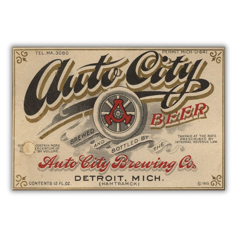 Beer label for Auto City Beer with a logo featuring an automobile tire with graphics in black, gold, and red on a beige background. Text reads “Tel. MA.3080 Permit Mich-U-641 Auto City Beer Brewed and Bottled by the Auto City Brewing Co. Detroit, Mich. (Hamtramck) Tax Paid at the Rate Prescribed by Internal Revenue Law Contents 12 FL. Oz. c 1915”