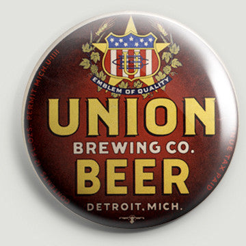 The front of a round bottle opener magnet featuring the beer label for Union Beer. Text on the label reads “Union Brewing Co. Beer Detroit, Mich. Emblem of Quality” and features yellow and white text on a red background.