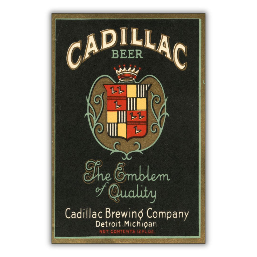 Beer label for Cadillac Beer featuring a coat of arms with text in white, turquoise, and red on a black background with a brown border. Text reads “Cadillac Beer The Emblem of Quality Cadillac Brewing Company Detroit, Michigan Net Contents 12 FL OZ”