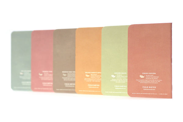 The backsides of six Field Notes Harvest notebooks, each one is a different pastel color.