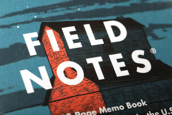 Close-up of the Field Notes logo on front cover of the Heartland notebook.