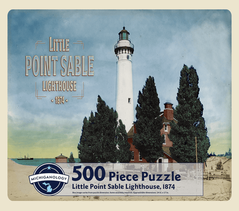 Colorized historical image of Little Point Sable Lighthouse and keeper’s dwelling. Puzzle cover text reads “500 Piece Puzzle Full Image Insert Included inside this box! Little Point Sable Lighthouse, 1874 Box image varies from puzzle dimensions. Some assembly required. Approximate dimensions: 17 in. x 24 in.”