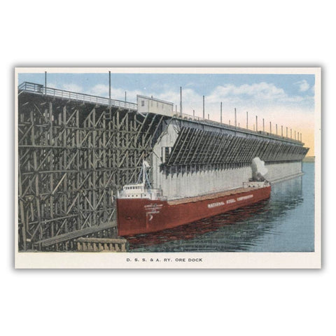 A historical postcard of the D. S. S. & A. Railway Ore Dock with a National Steel Corporation ship docked at it.