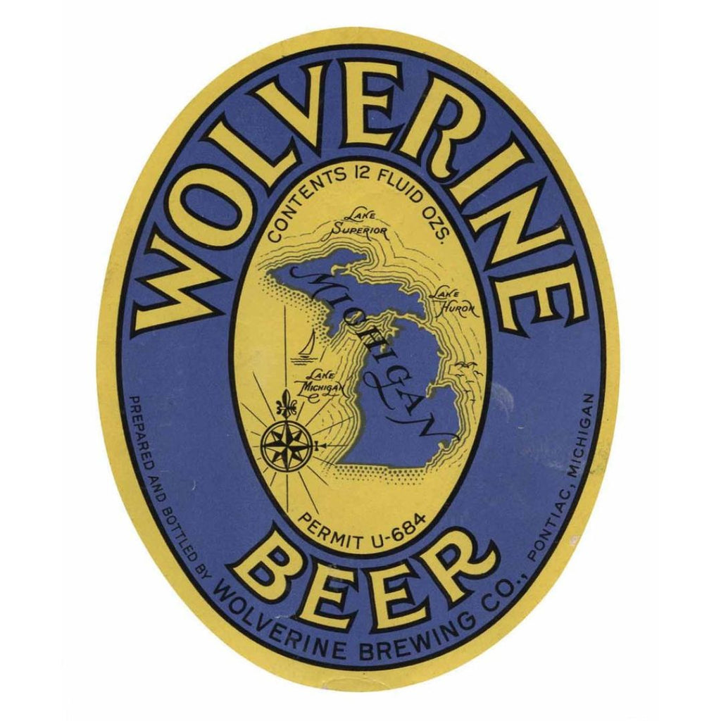 Beer label for Wolverine Beer featuring the state of Michigan in the center with text in yellow and black on a blue background. Text reads “Wolverine Beer Prepared and Bottled by Wolverine Brewing Co., Pontiac, Michigan Contents 12 Fluid Ozs. Permit U-684”