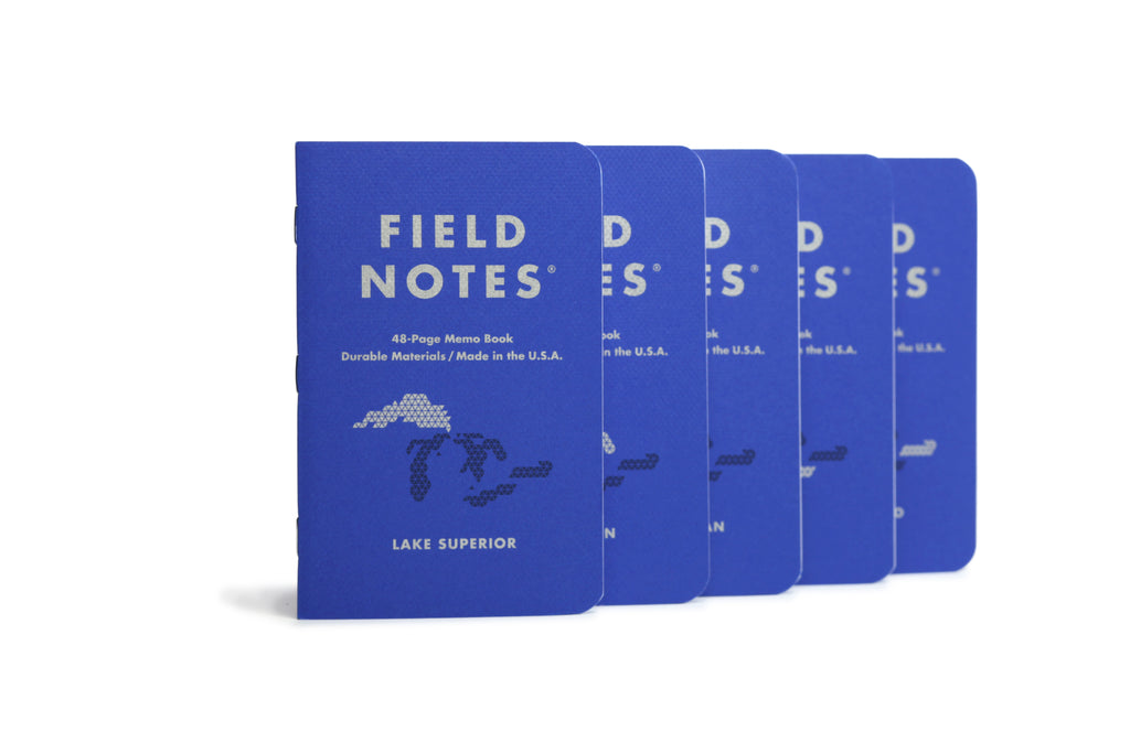 The front of five Field Notes Great Lakes notebooks with Lake Superior in front.