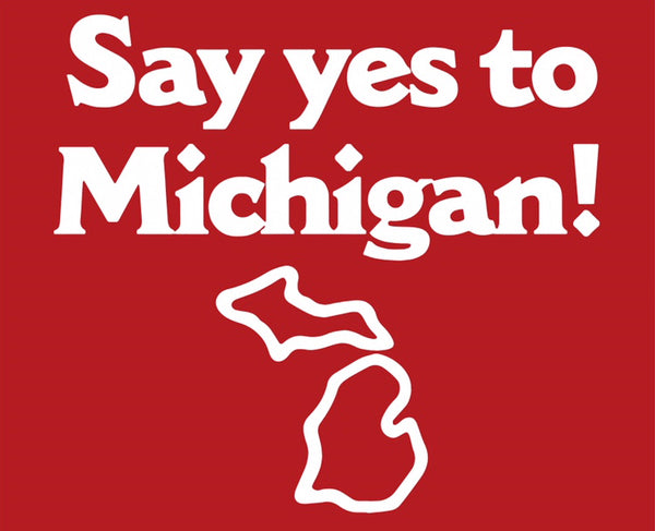 Logo for “Say Yes to Michigan!” in bold white text with a white outline of the state of Michigan underneath it on a red background.