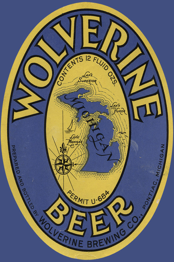 Beer label for Wolverine Beer featuring the state of Michigan in the center with text in yellow and black on a blue background. Text reads “Wolverine Beer Prepared and Bottled by Wolverine Brewing Co., Pontiac, Michigan Contents 12 Fluid Ozs. Permit U-684”