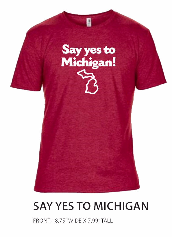 Front of a red t-shirt featuring the text in white lettering “Say yes to Michigan!” with a white outline of the state of Michigan beneath it. Black text on bottom of image reads “Say Yes to Michigan Front – 8.75” wide x 7.99” tall”